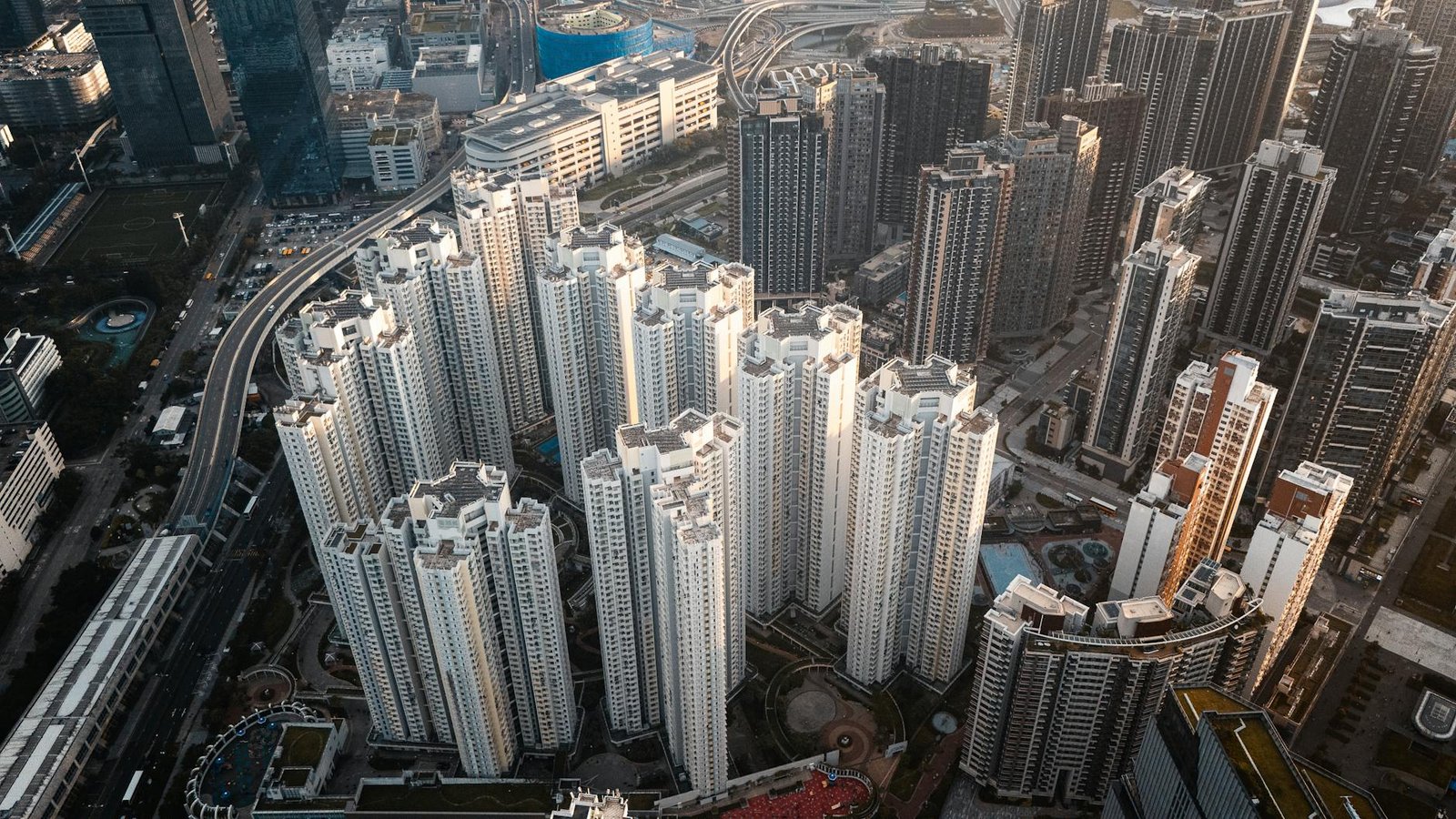 High-rise residential buildings in Kowloon, Hong Kong captured from above showcasing urban density.