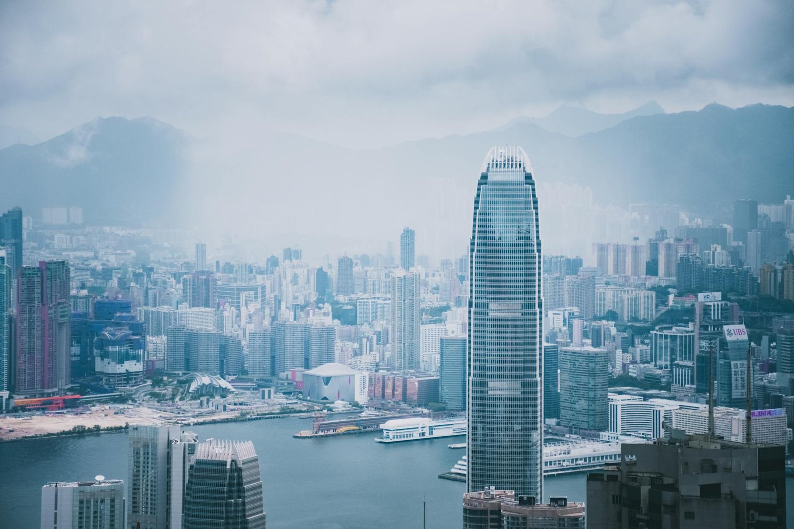 Panoramic view of Hong Kong's modern skyline featuring iconic skyscrapers and urban architecture.